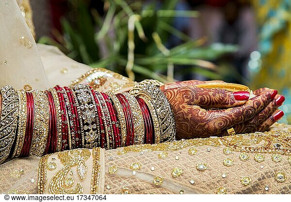 Traditional bridal jewelry and henna decoration on the hands of a bride during a religious ceremony at a Hindu wedding  Mauritius  Africa