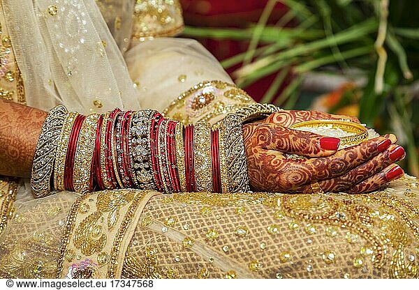 Traditional bridal jewelry and henna decoration on the hands of the bride during a religious ceremony at a Hindu wedding  Mauritius  Africa