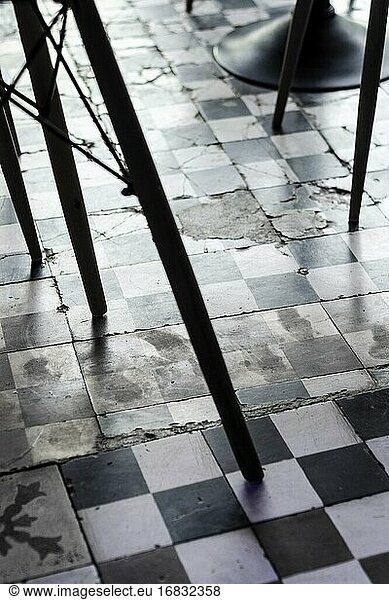 Traditional design old rustic floor tiles detail in trendy Ibiza cafe.