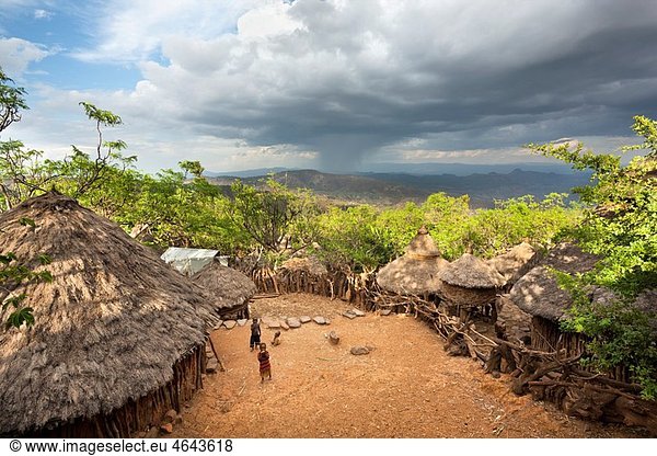 Traditional Konso village on a mountain ridge overlooking the rift valley The Konso are living in tradtional villages with compunds for each family The compounds are connected by a maze of stone walled and fenced pathways The Konso  a tribe of the Ethi