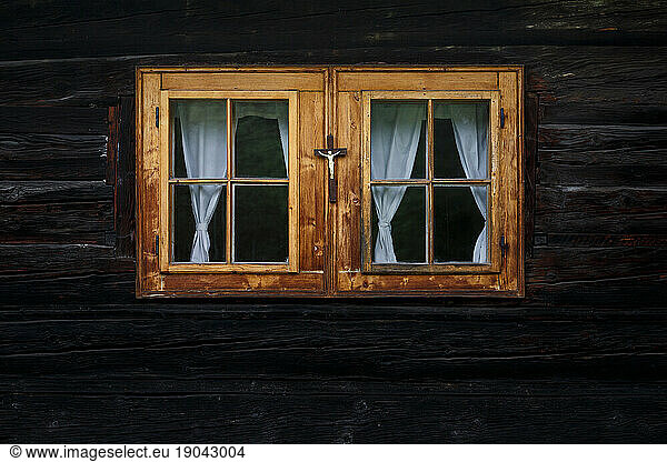 Traditional log cabin with a crucifix  Orava region  Slovakia.