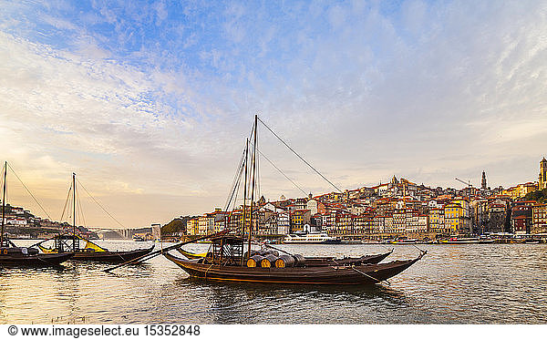 Traditional Portuguese wooden cargo boats transporting port wine on Douro River  Porto  Portugal