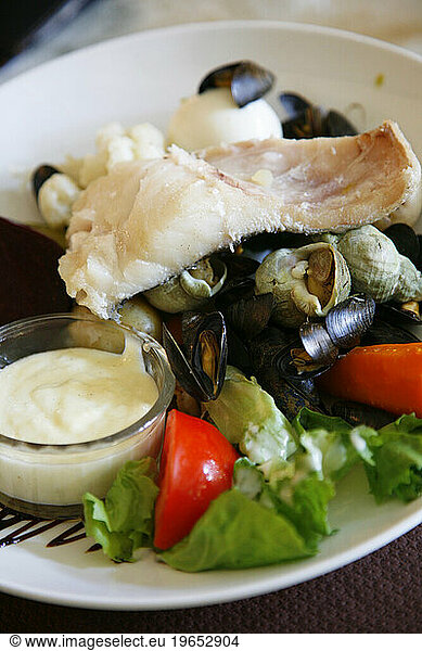 Traditional Provencal Aioli dish served with boiled fish and vegetables  Provence  France.