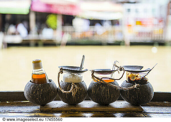 Traditional Thai condiments at outdoor restaurant