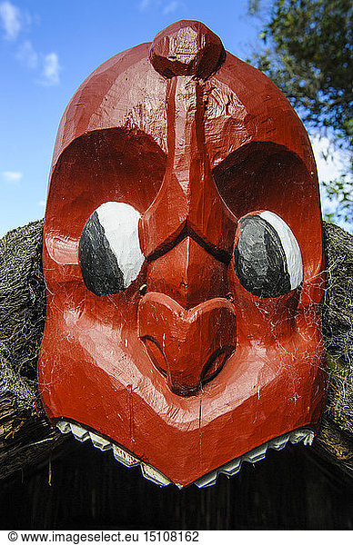 Traditional wood carved mask in the Te Puia Maori Cultural Center  Rotorua  North Island  New Zealand