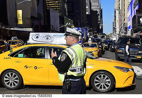 Traffic cop regulates traffic jam at Times Square  Manhattan  New York City  New York State  USA  North America