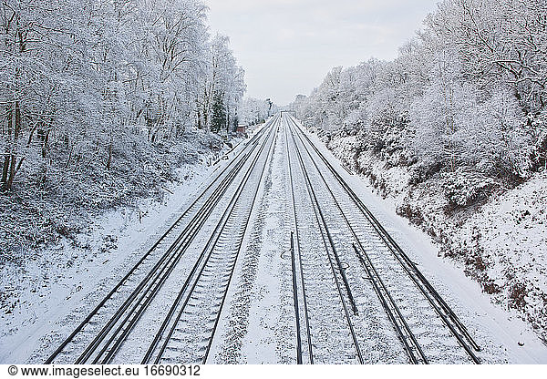 train tracks in frozen winter landscape in south England