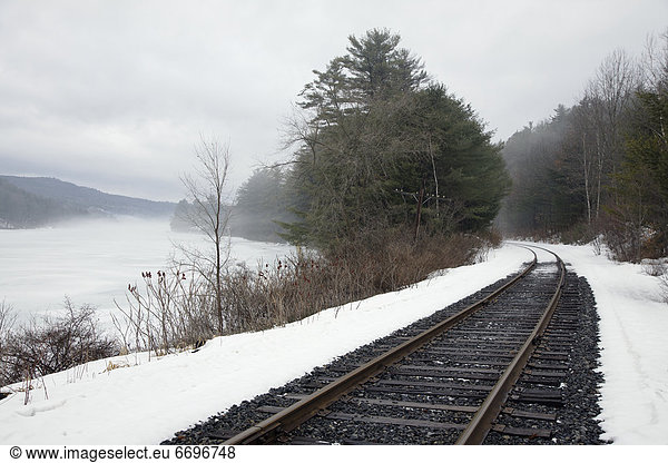 Train Tracks In Snowy Landscape