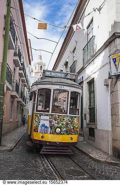 Tram in Alfama street of Lisbon  Portugal