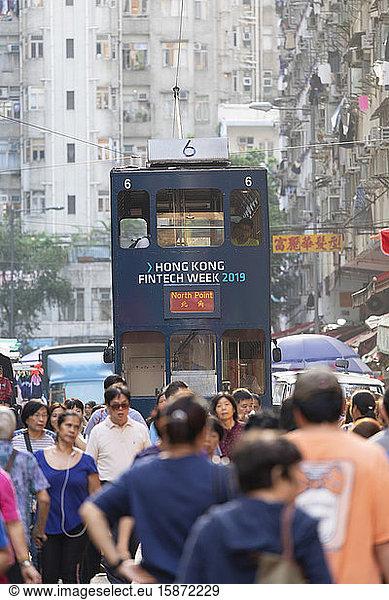 Tram passing along Chun Yeung Street market  North Point  Hong Kong Island  Hong Kong  China  Asia