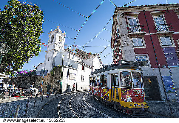 Tram passing in old town of Alfama  Lisbon  Portugal