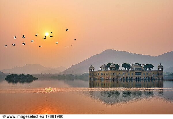 Tranquil morning at famous indian tourist landmark Jal Mahal (Water Palace) at sunrise in Jaipur. Ducks and birds around enjoy the serene morning. Jaipur  Rajasthan  India