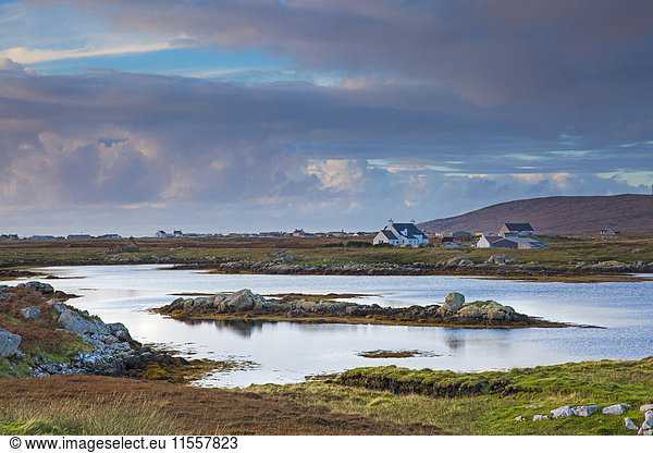 Tranquil scene clouds over lake and fishing village  Lochboisdale  South Uist  Outer Hebrides