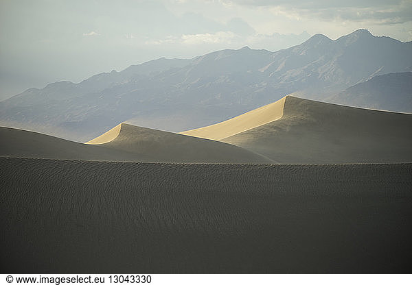 Tranquil view of desert against mountains
