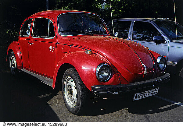 transport / transportation  car  vehicle variants  Volkswagen  red VW Beetle 1300  side view from ahead  Germany  circa 1990  motor car  auto  automobile  passenger car  motorcar  motorcars  autos  automobiles  passenger cars  parking  antenna  antennae  antennas  bumper  bumper bar  bumpers  bumper bars  bow  bows  front  fronts  headlight  1990s  90s  1980s  80s  20th century  transport  transportation  car  cars  beetle  bug  beetles  bugs  historic  historical