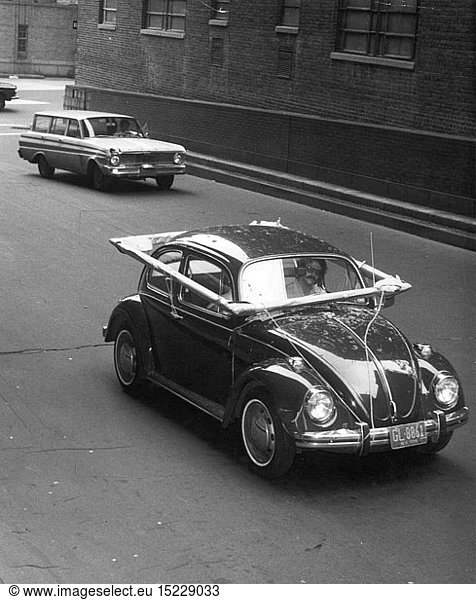 transport / transportation  car  vehicle variants  Volkswagen  VW beetle  art student transporting ultralarge picture frame  New York  1967