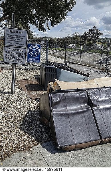 Trash and furniture dumped at side of the road  Culver City  Los Angeles  California  USA.