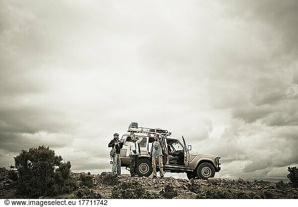 Travellers Beside Their Four Wheel Drive Vehicle In The Simien Mountains; Ethiopia