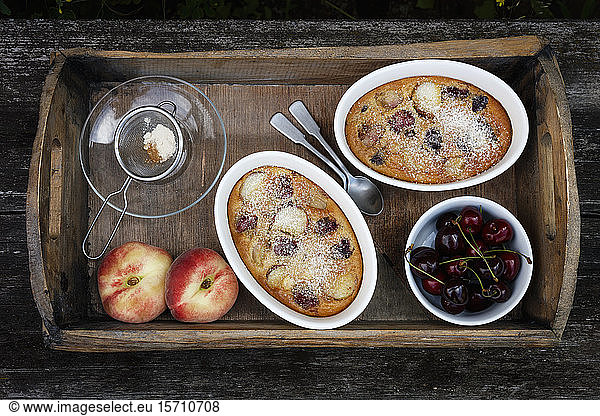 Tray with bowls of homemade gluten free clafoutis