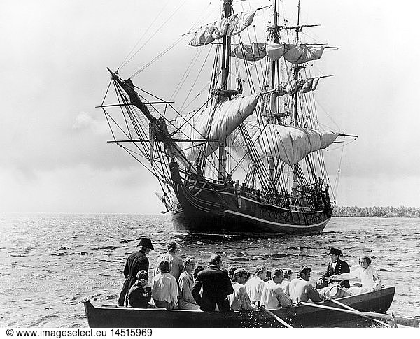 Trevor Howard and Crew Adrift in Longboat with HMS Bounty in Background  on-set of the Film  Mutiny on the Bounty directed by Lewis Milestone  1962