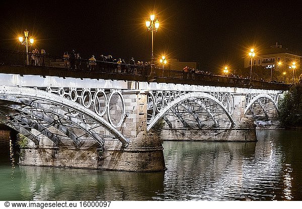 Triana bridge and its characteristic lighting. Seville  Andalusia. spain.