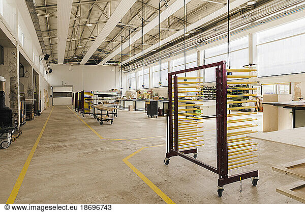 Trolley with racks in modern carpentry factory