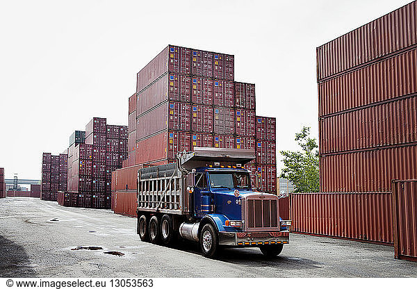 Truck and cargo containers at commercial dock