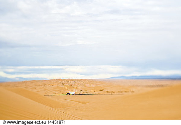 Truck Driving Through Desert