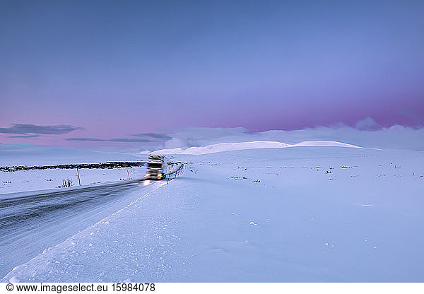 Truck on country road in winter  Tana  Norway