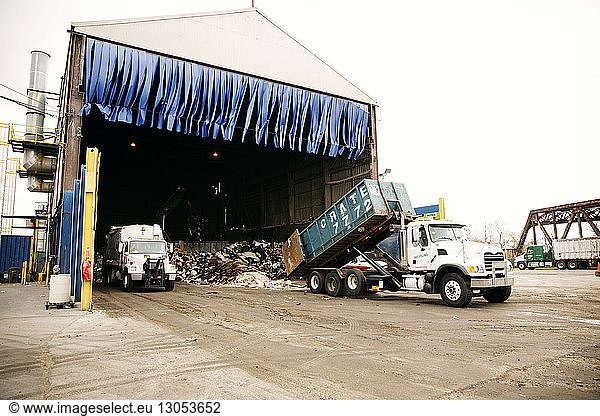 Truck unloading garbage at recycling plant