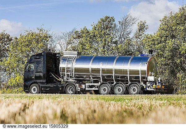 Truck with silo trailer on a dirt road  tank truck  Denmark  Europe
