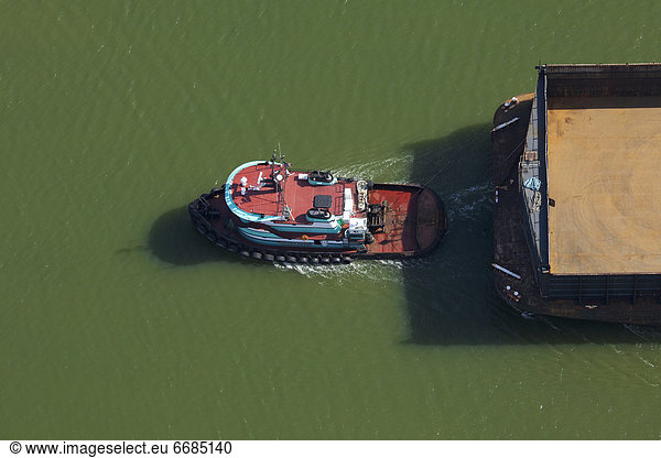 Tugboat Pulling a Barge