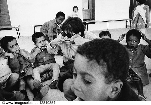 TUNISIA: PEACE CORPS. Ellen Robertson  a Peace Corps volunteer  with a class of children at the Jardin d'Enfants (similar to the Head Start program)  in Sousse  Tunisia. Photograph  c1971.
