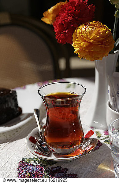 Turkey  Alacati  Black tea on table with flower vase