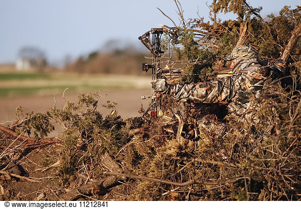 Turkey Hunter Sits In Ground Blind Made From Natural Materials