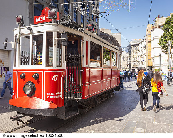 Turkey  Istanbul  Beyoglu  tourists and historical tram on Istiklal Avenue