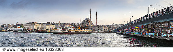 Turkey  Istanbul  Eminonu Harbor  Restaurants on Galata Bridge and Yeni Cami  New mosque