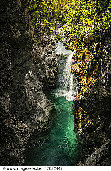 Turquoise river and waterfall