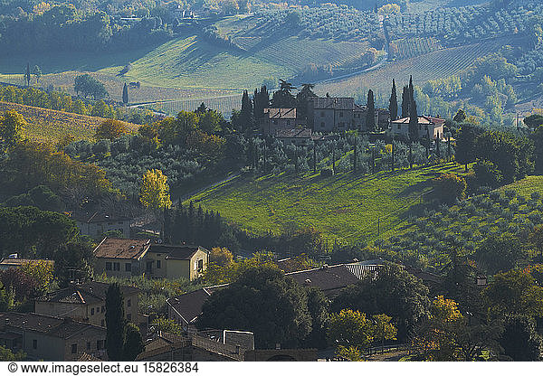 Tuscany countryside from above showing farmhouse.