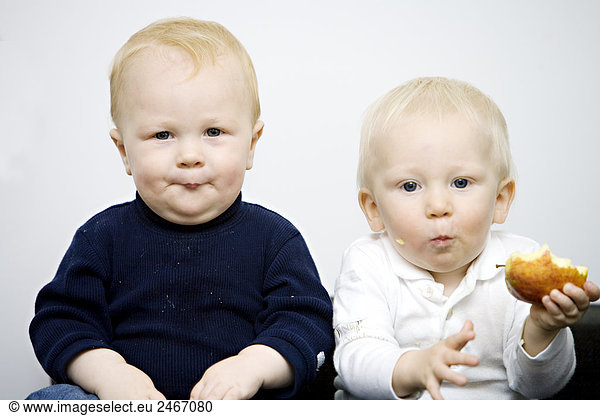 Two babies making faces Sweden.