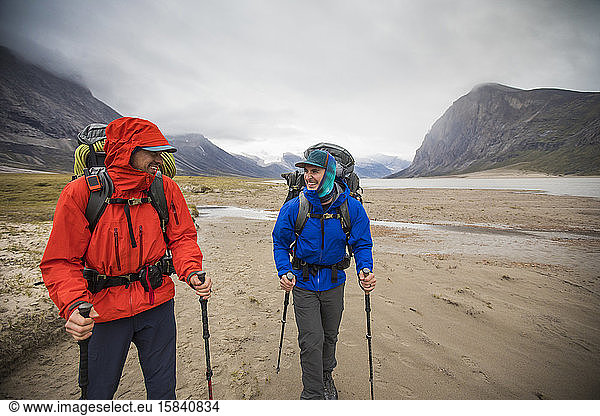 Two backpackers enjoy hiking in remote location  Baffin Island.