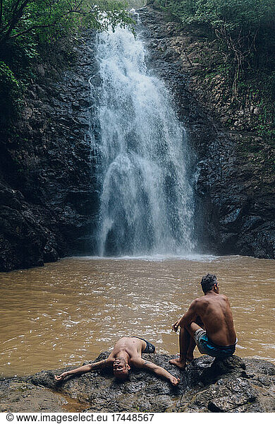 two best friend relaxing during a amazing day in the waterfalls