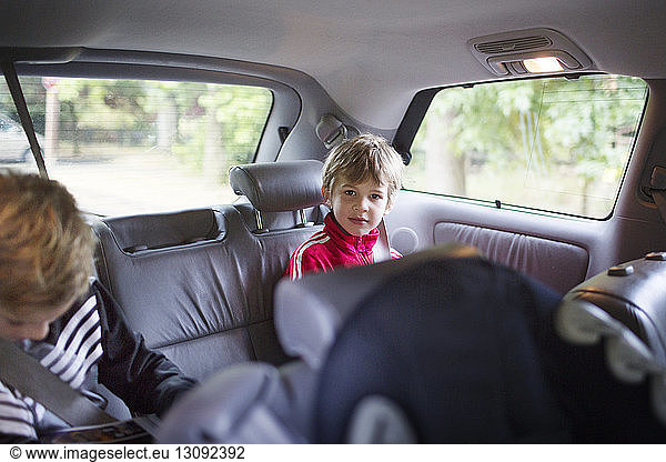 Two boys sitting in car