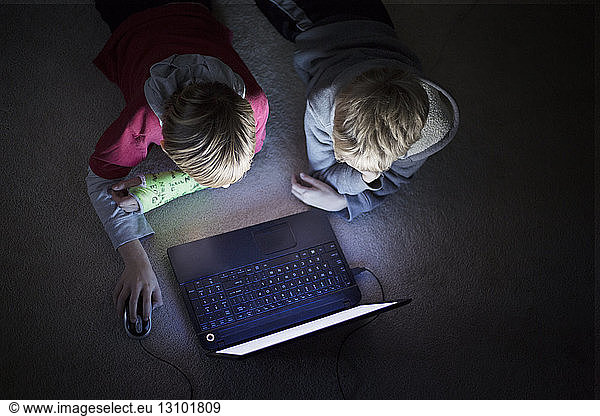 Two boys using laptop
