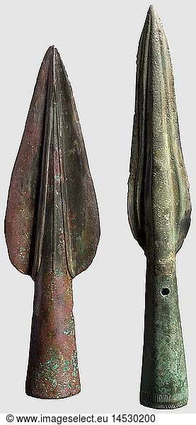 Two bronze spearheads  Central Europe  Bronze Age  circa 1000 B.C. Bronze with brownish  respectively slight greenish patina. One spearhead with broad  leaf-shaped point  the edges partly restored. The rounded midrib decorated with three ridges. Round  slightly tapered socket with two fixation holes. The second example has a slender point with curved edges  rounded midrib with two ridges at the sides. Slightly tapered socket with two fixation holes and engraved dÃ©cor at the base. Length 16.3 and 19.1 cm  historic  historical  ancient world  ancient world  ancient times  object  objects  stills  clipping  cut out  cut-out  cut-outs  weapon  arms  weapons  arms  object  objects  stills  clipping  clippings  cut out  cut-out  cut-outs
