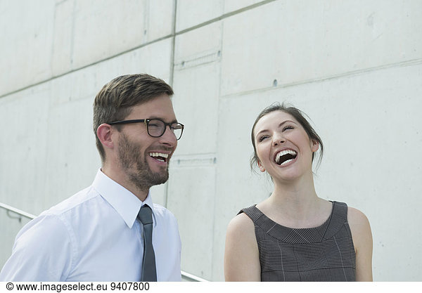 two business partners laughing