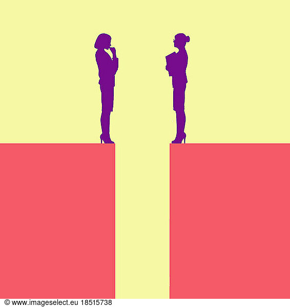 Two businesswomen talking from edges of separate blocks