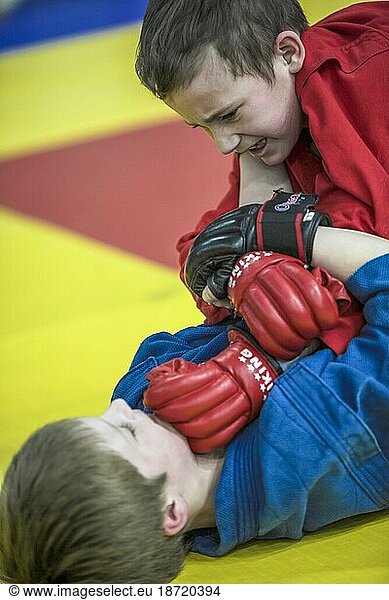 Two Childrens Compete At A Taekwondo Tournament