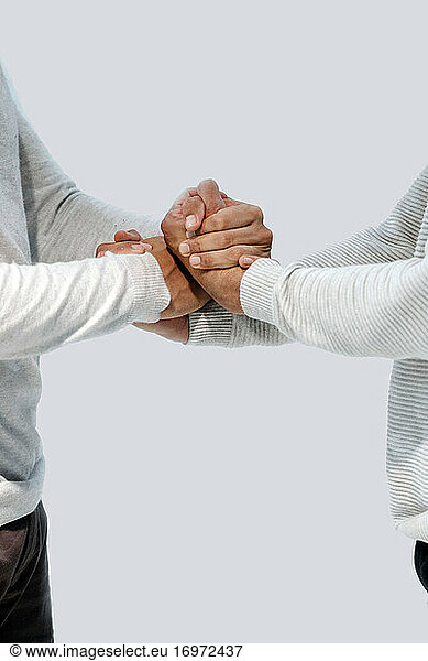 two dancing boys hold hands facing each other
