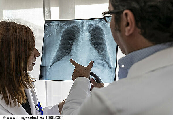 two doctors read a chest x-ray